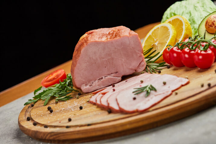 Ham placed on a board
